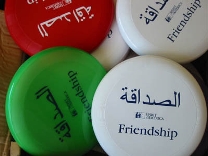 The Frisbees Imprinted With Friendship in Arabic and English